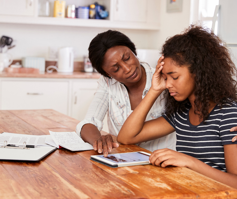 Mother talking to anxious daughter.